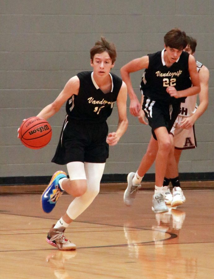 Evan Farrow faces off against Austin high in vandegrift basketballs season opener.