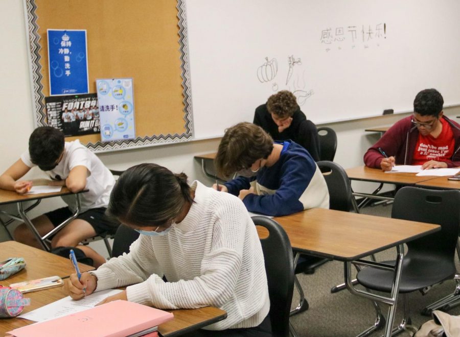 Students in Chinese class working on their assignments the week after returning from Thanksgiving break.