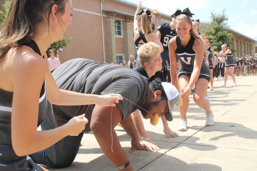 At the court yard, on Aug. 26 at around noon, cheerleaders, band members, and students of Vandegrift cheered the high school foot ball team. The sophomore students got to leave 5 minutes because one of the sophomore student was able to eat a donut the fastest.