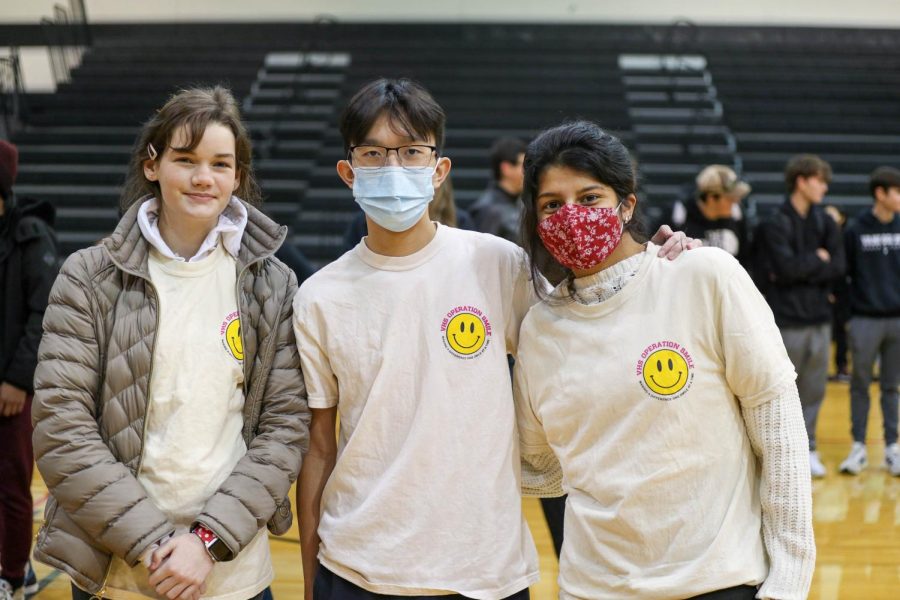 Juniors Mckenna Cardwell, Bryan Dam, and Roma Kelkar represent their club Operation Smile 