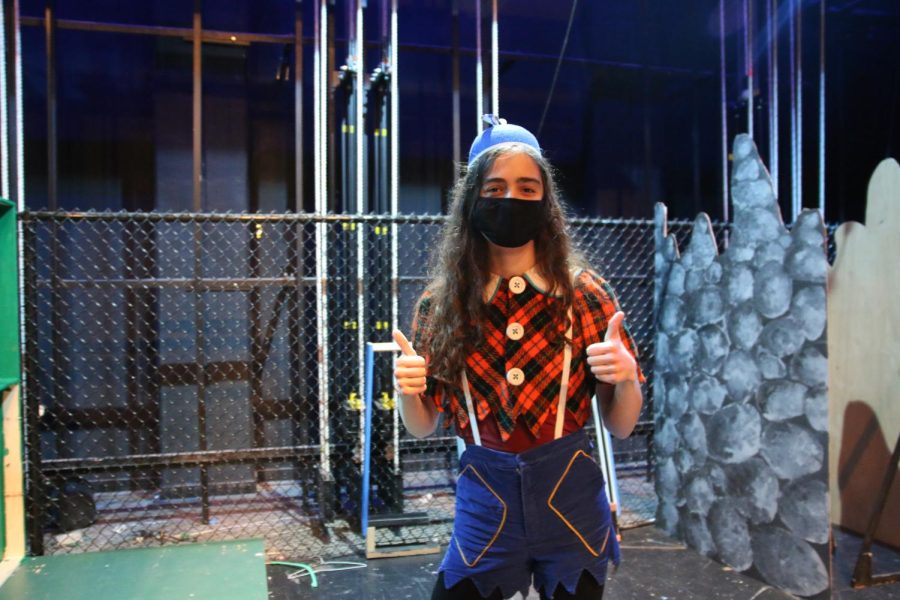 One of the cast members poses for a picture while getting ready for rehearsal. 