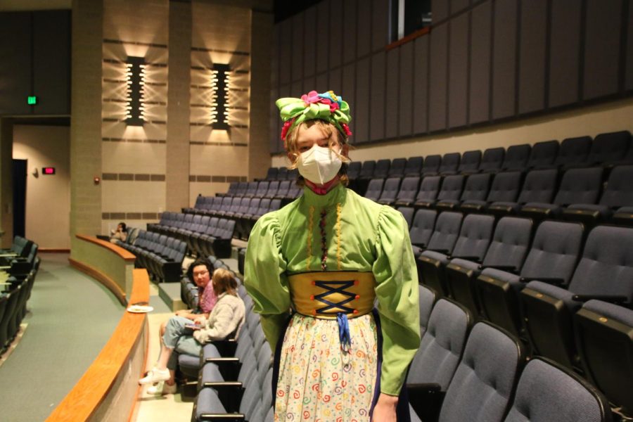 sophomore Blue McClellan decked out in their munchkin costume. I just hope they are excited to see  cool stuff, in particular the flying scene, Miguellen said.