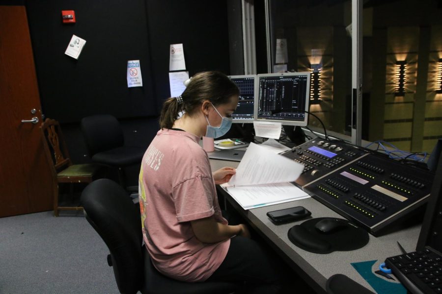 senior Brooke Dickerson reads over her notes before rehearsal starts. Im the light designer so Im typically spending most of my time here, and I also like to hang out and chill here, Dickerson said.