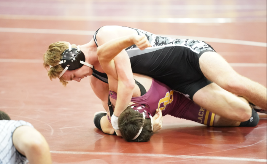 In December at Dripping Springs, junior Rex Jacops pins his opponent. Jacops joined seven other wrestlers who qualified for the state tournament in Cypress.