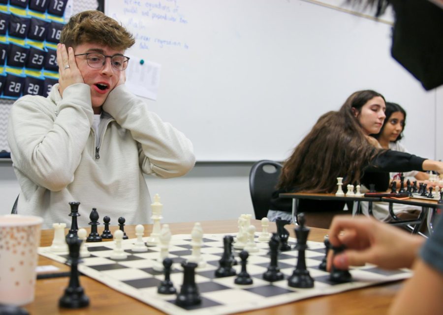 During the chess clubs tournament after school on Wednesday, Oct. 6, junior James Penver reacts as he realizes his mistake.