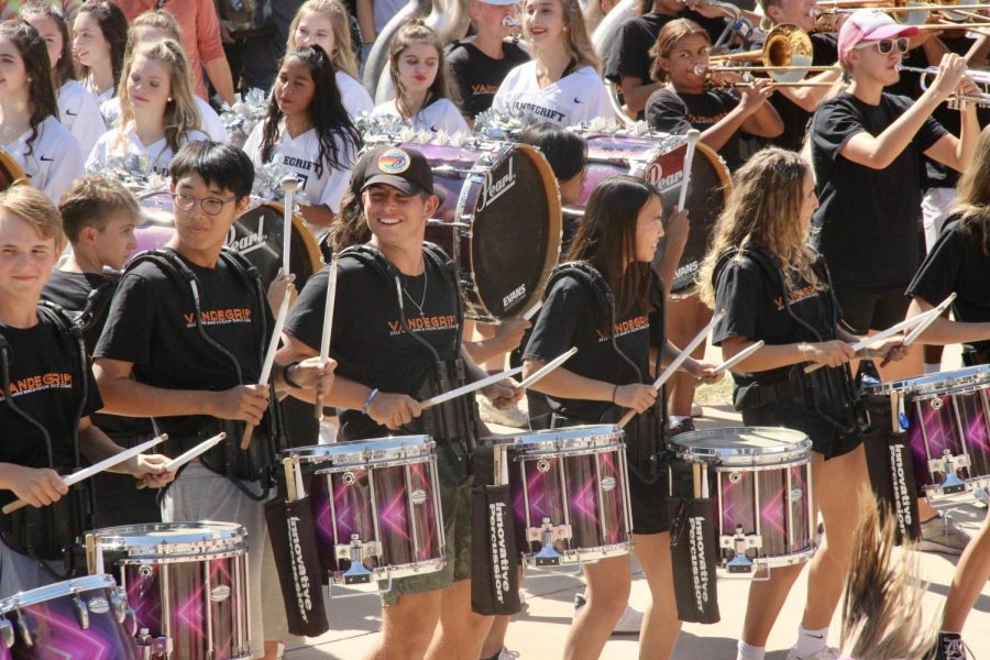 Bands+drumline+performs+at+the+end+of+the+pep+rally+with+the+Legacies+and+cheer+team.