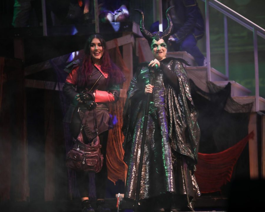 Mal (Alaina Riddle) and Maleficent (Emerson Hartman) discuss their plan to steal fairy godmothers wand.