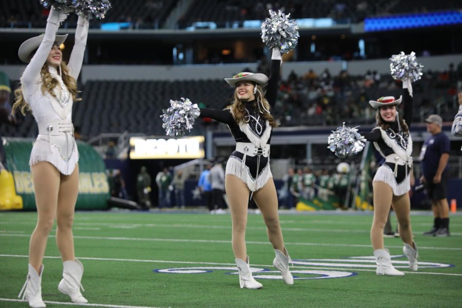 The Legacies celebrate one last football game performance in their uniforms before winter break and competition season begins for dance in the spring.