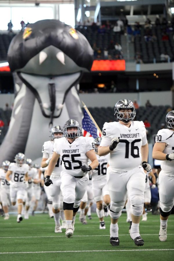 The team storms out of the Viper tunnel at the beginning of the game with senior offensive linemen Ryan Dewhurst and Archer Spelman pacing the front.