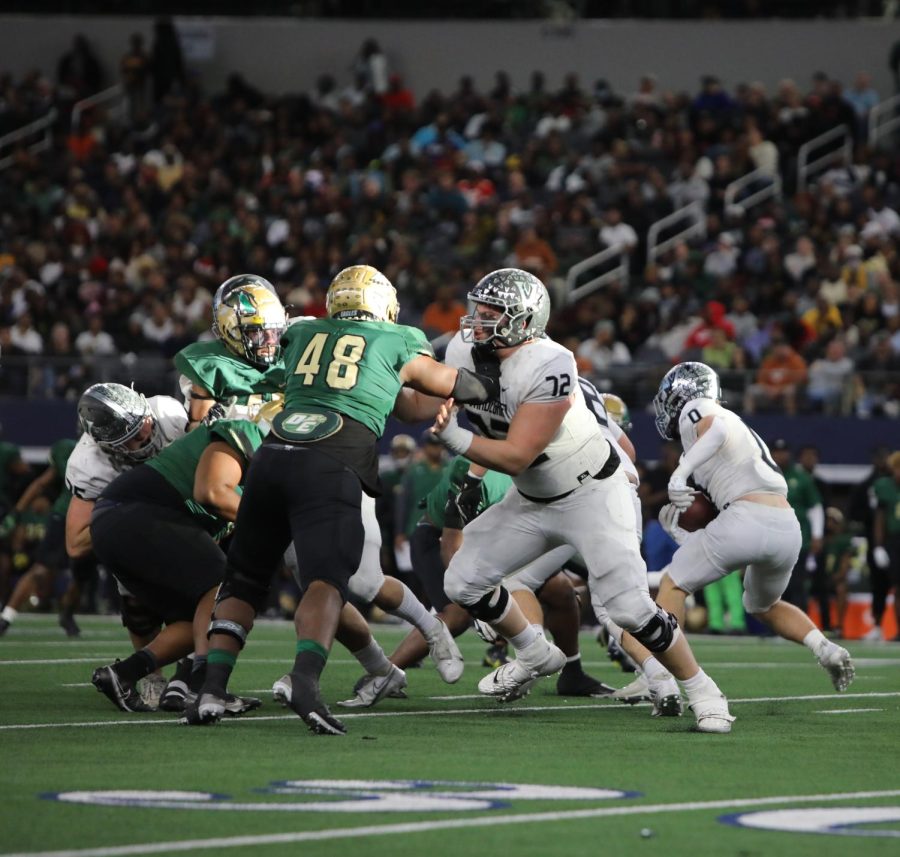 Containing, senior offensive lineman Ian Reed bottles up DeSoto to make way for senior running back Alex Witt.