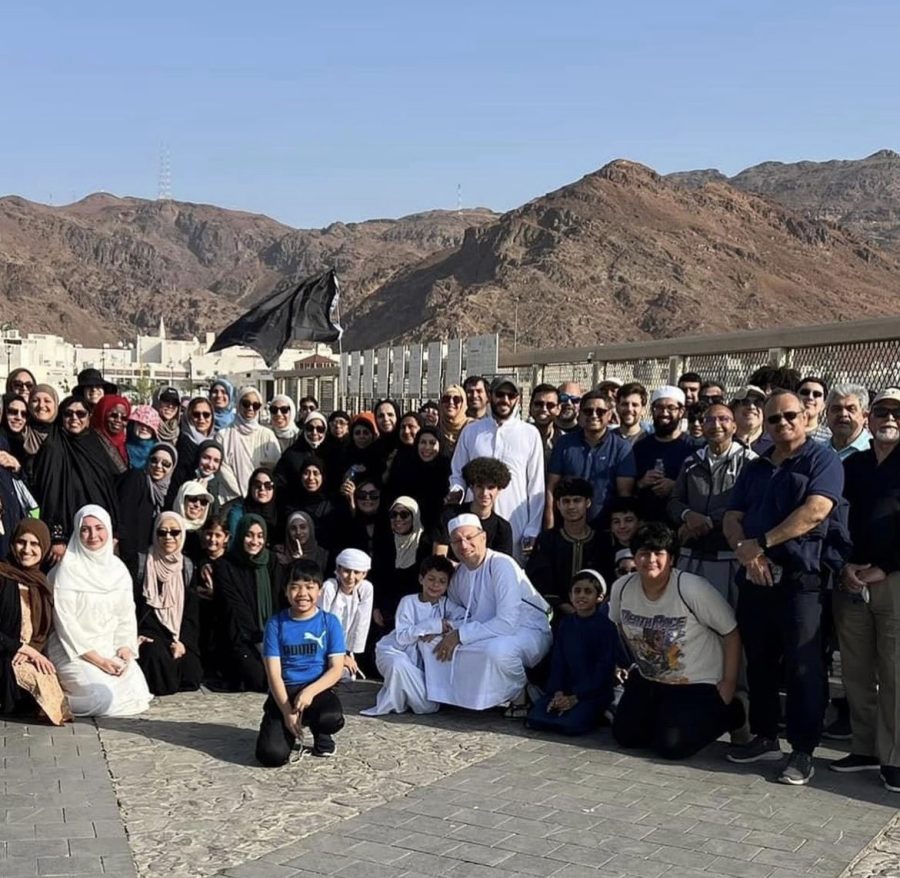 All the Manasik group members pose for a photo in front of the Uhud Mountain.