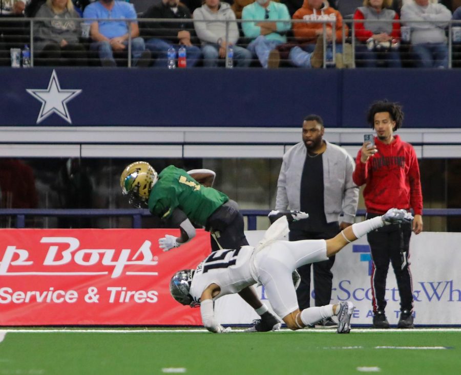 Safety senior Isaiah Thompson saves a would-be touchdown by forcing the DeSoto runner out of bounds.