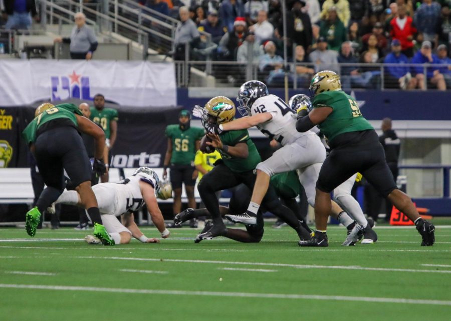 DeSoto's rushing game challenges the defense as senior defensive lineman Oliver Yndo tries to stop the penetration.