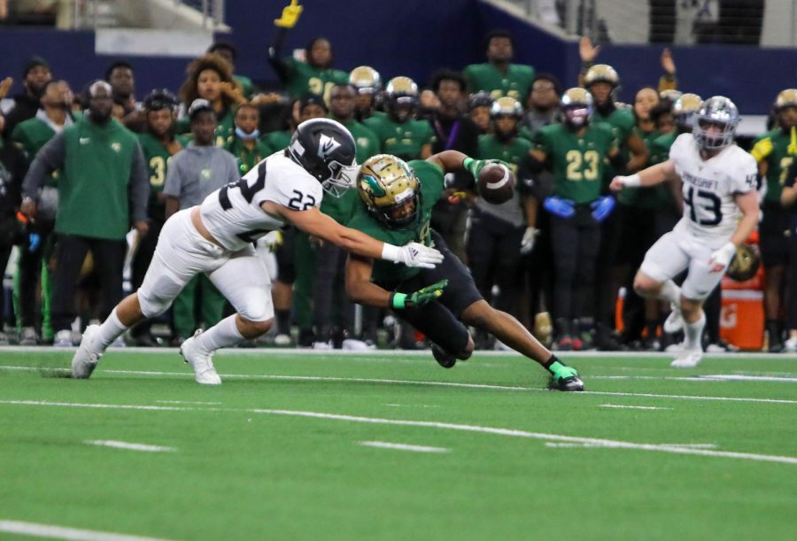 Senior defensive back Cruz Orta tracks down DeSoto quarterback Darius Bailey as he tries to scramble.