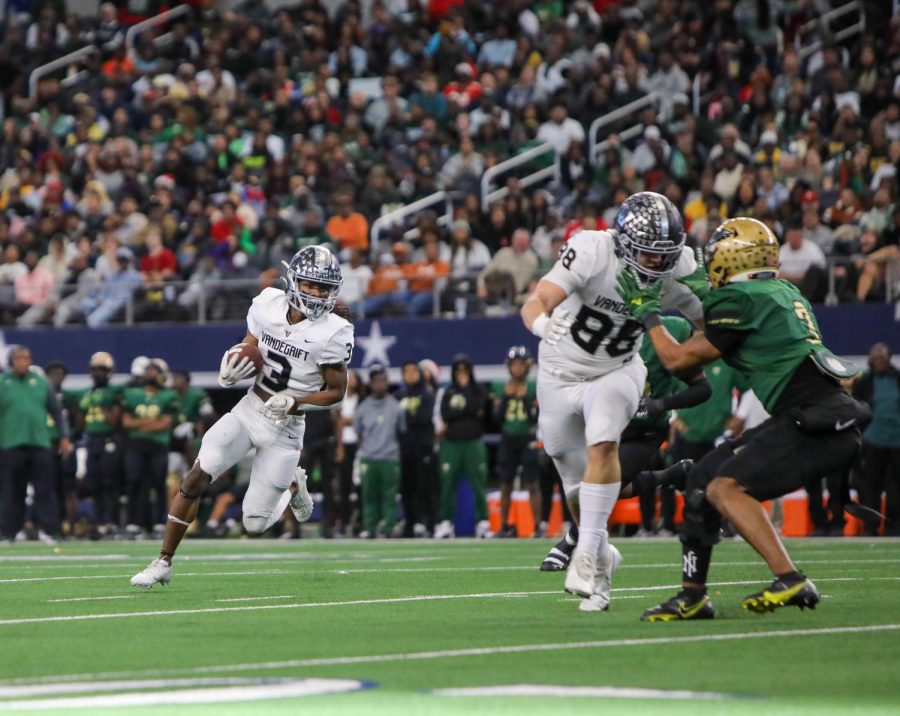 Handling the returns, senior RayJean Middleton races past the 20-yard line.