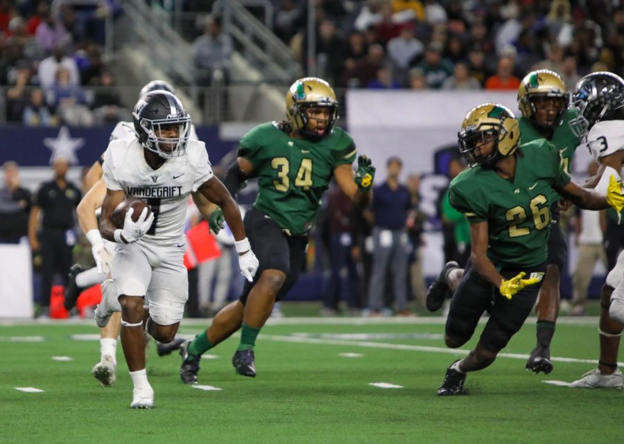 Turning the corner, junior wide receiver Miles Coleman takes a big gain up the sideline.