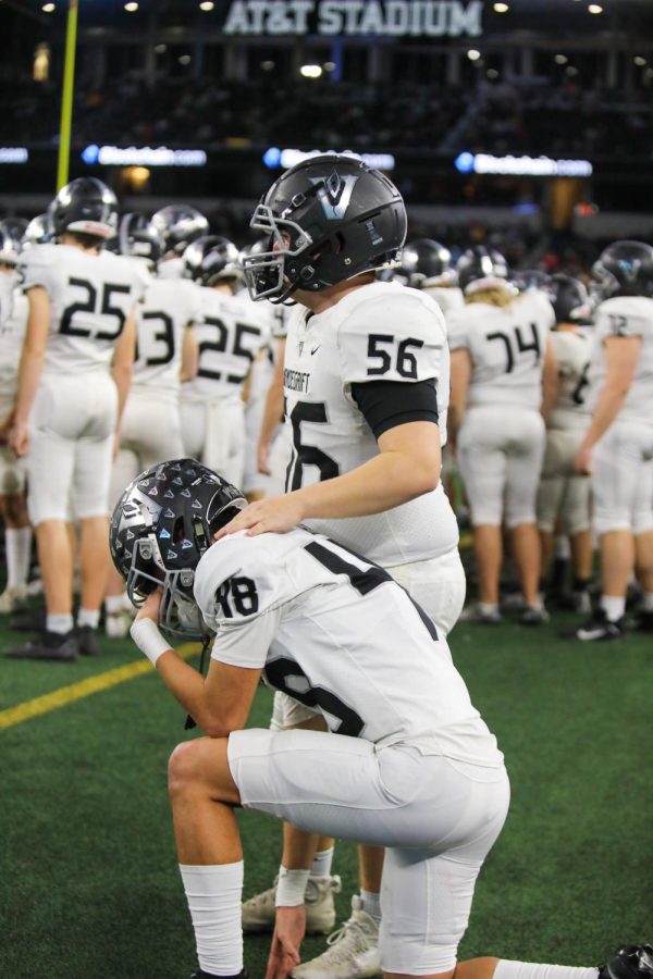 As the seconds tick off the clock, senior offensive lineman Braeden Gradwell consoles senior defensive back Jayden Harris.