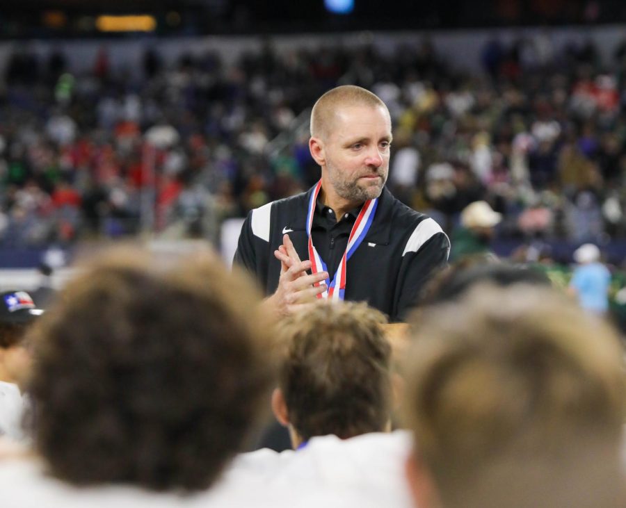 Containing his emotions, Head Coach Drew Sanders settles in for the last post game talk with his players on the year.