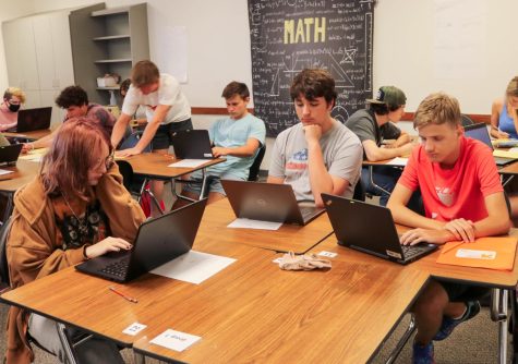 Students use their computers to complete work in class. With the rise of AI cheating, teachers are reconsidering how to ensure the legitimacy of students work.