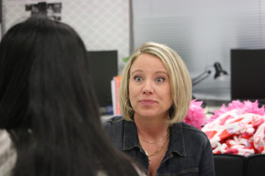 Mrs. Powell chats with senior Sarah McKelvy about her class assignments and class anecdotes.