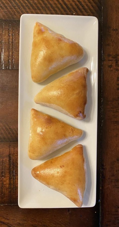 These cheese pies are glazed with egg wash for the perfect golden-brown color. Kross is also commonly made with a meat or spinach filling.