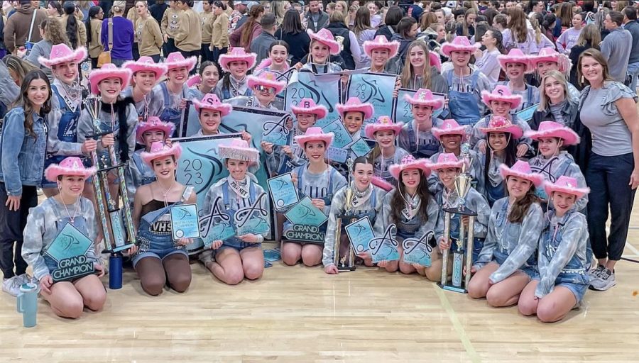 The Legacies team poses for a picture with their grand champion award. 