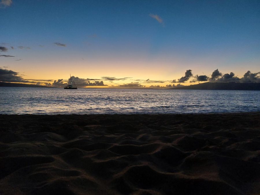 Students capture vivid sky pictures. Lockerman photographs the sunset at the beach.