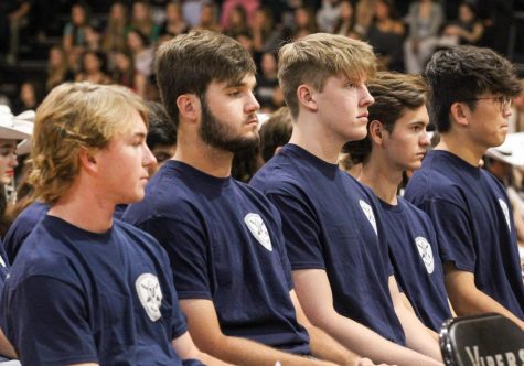 Second to None award recipients sit in the middle of the main gym on Valor Day as an honor and example to students of role models within their own programs. These students were voted as exemplars by their peers.