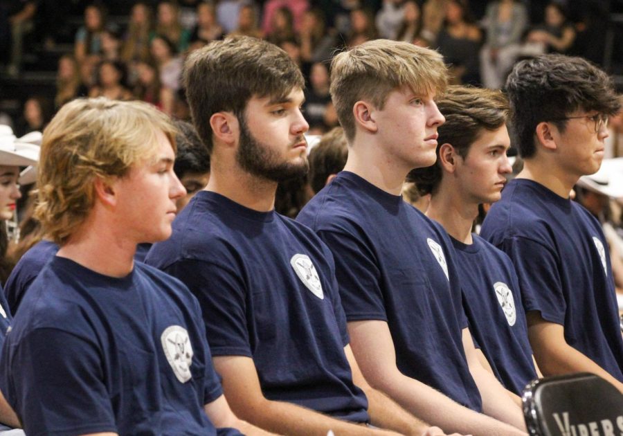 Second to None award recipients sit in the middle of the main gym on Valor Day as an honor and example to students of role models within their own programs. These students were voted as exemplars by their peers.