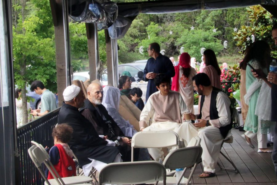 Canyon Ridge Middle School student, Imad, enjoys breakfast with the company of his family on the mosques deck. The mosque provided tacos, Round Rock Donuts and an assortment of fruit for breakfast.