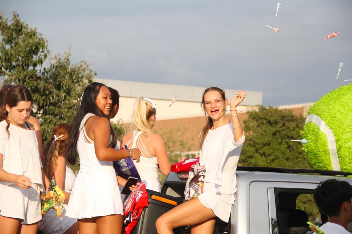 Tennis tosses more candy toward the crowd during the parade.