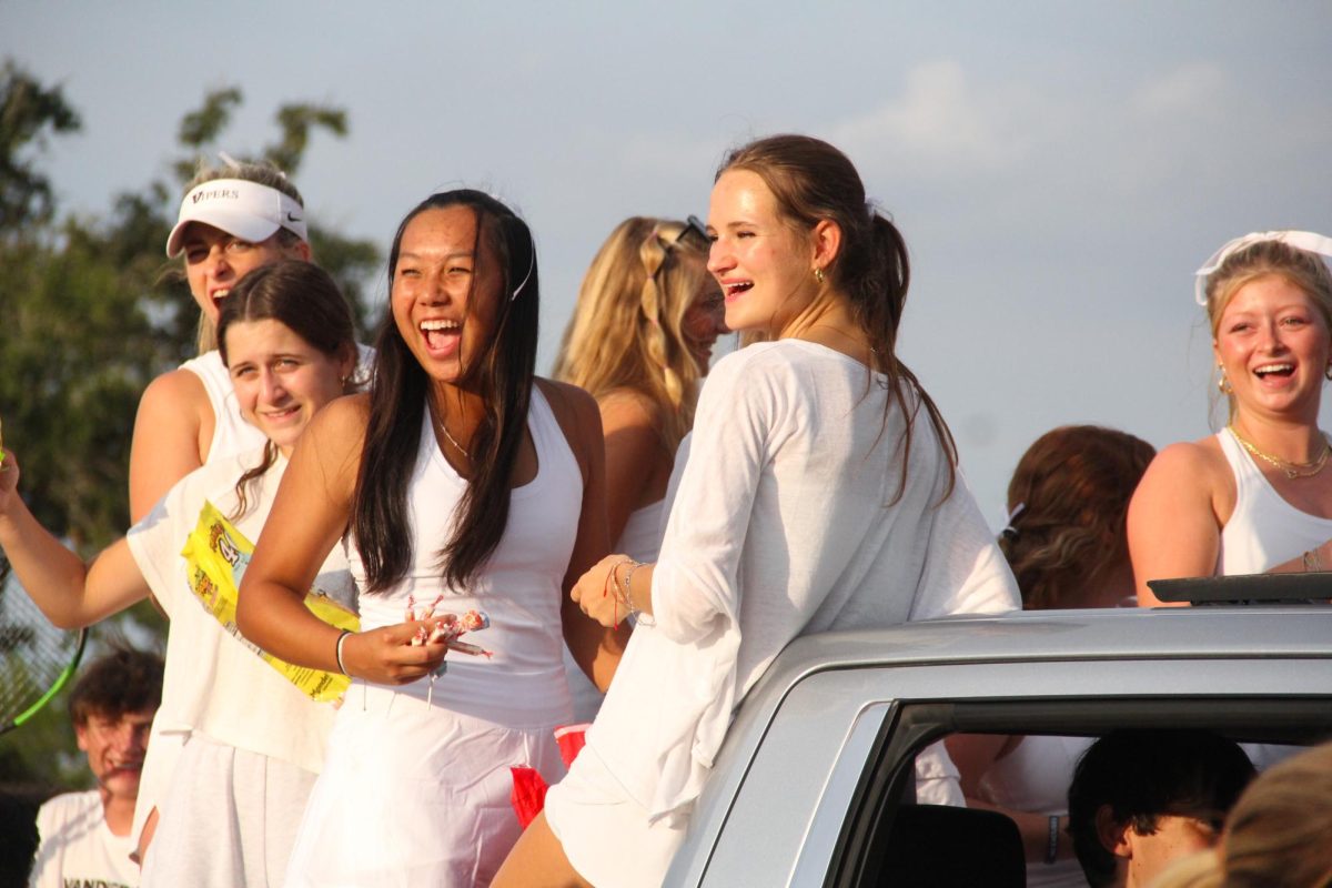 Captain Lauren Tin tosses candy from the tennis float.