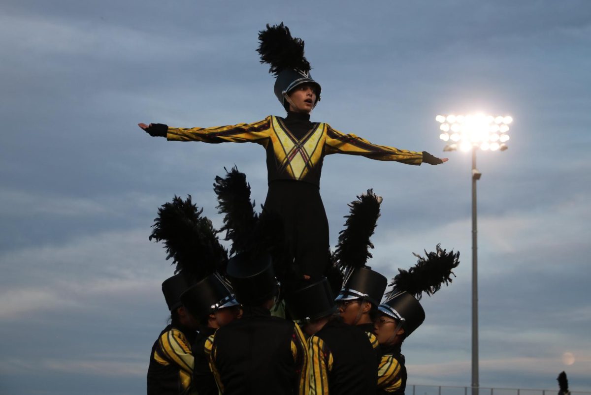 For Homecoming, the marching band performs Spotlight during halftime of the varsity football game against Manor. The band had just placed second at Bands of America.