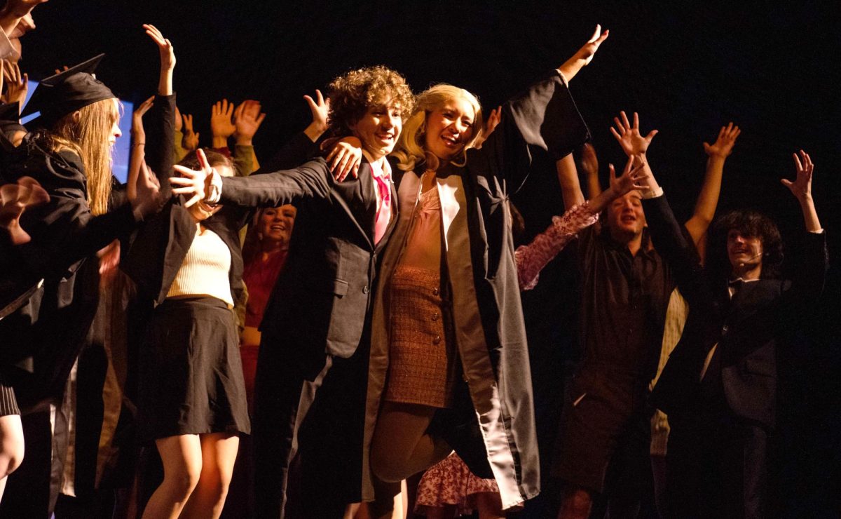 Nearing the end of the play Legally Blonde, much of the cast gathers around and cheers. They performed on Wednesday for the staff for free.