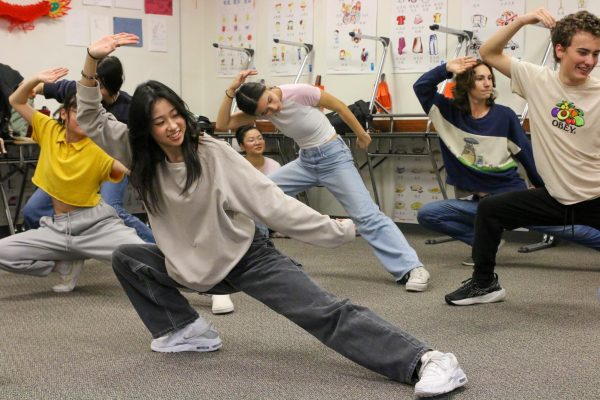 Senior Amelia Lo practices a finishing pose alongside classmates. On Thursday, the Chinese 3 class hosted a Kung Fu session sponsored by the Austin Chinese-American Network. 