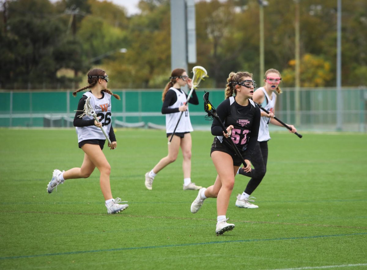 Advancing down the field, junior Brynley Pearce looks to score. Pearce felt like the team’s performance was a strong way to start the season. “I am excited to watch how our team adapts to the game this year and how we play against other schools,” Pearce said. “I enjoy watching the team grow and play well together.”