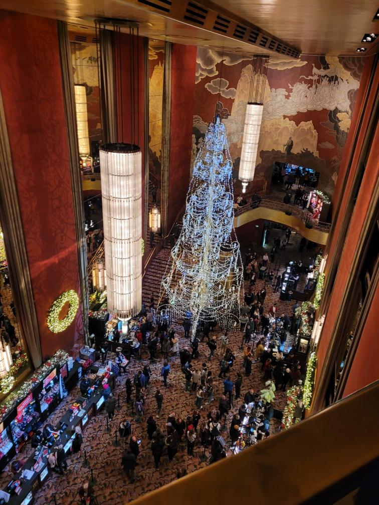 Inside the Radio City Hall, people gather to celebrate the holidays.