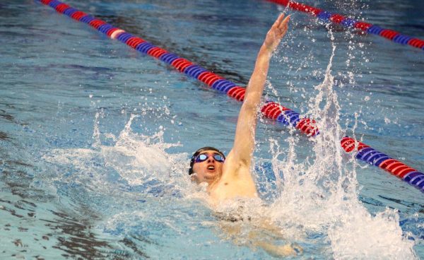  Senior Jack Ritter darts across the pool while swimming backstroke, helping the boys team secure a second place finish overall. “We’re in a good place for the rest of the season,” Ritter said. “Swimming is something I’ve always grown up doing. I enjoy the competitive aspect of it. It’s something I just kind of worked on and got good at.
