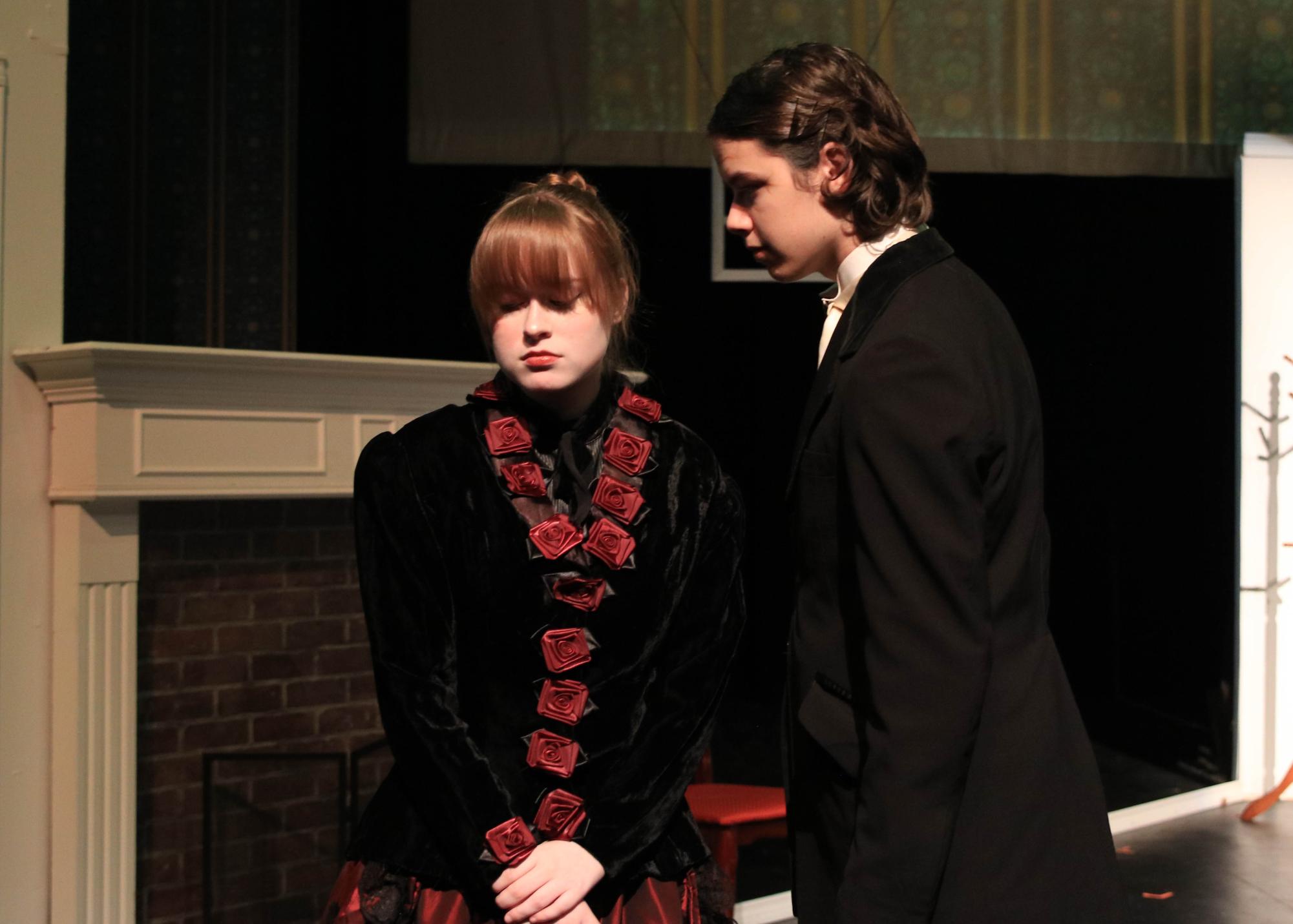 Portraying the role of Nora in A Dolls House Part 2, senior Maddie Sparta looks away as Torvald (portrayed by senior Wesley Jackson) approaches her in a tense conversation. A Dolls House Part 2 follows the plotline established in the prequel with a 16 year time jump.