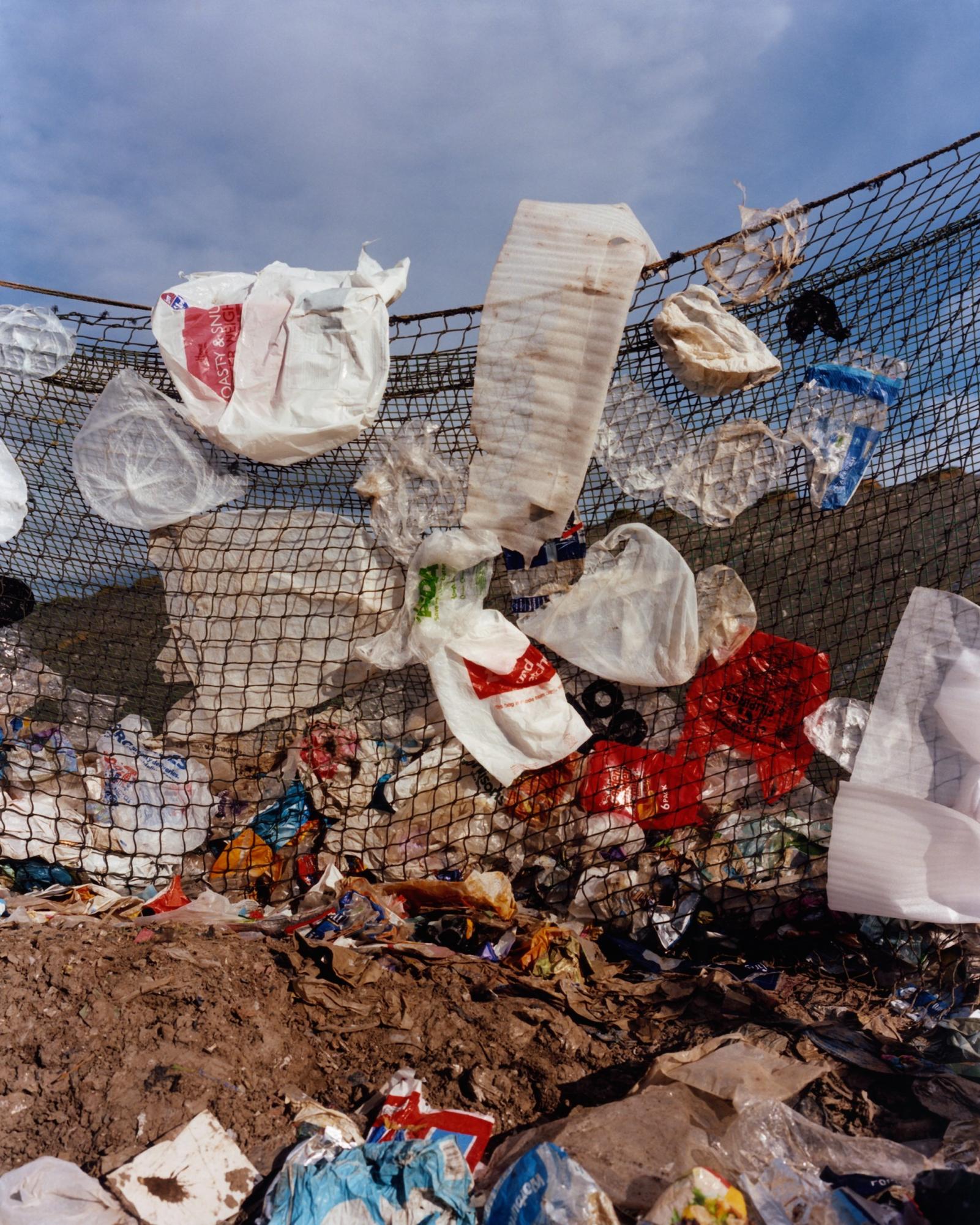 Unrecyclable debris tangled in nets near garbage dumps in London, England.