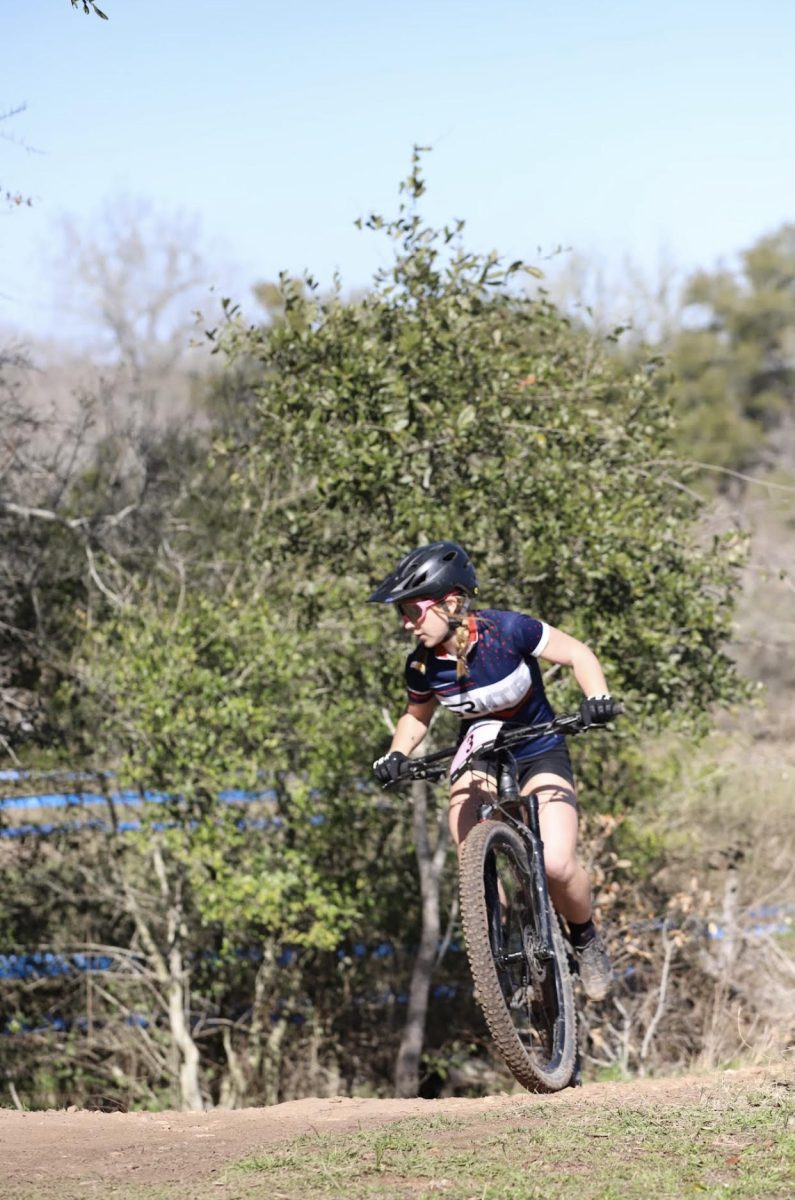 McRorie races to the finish line during race. Mountain biking students race on a variety of courses and trails throughout the year, including some in the Austin area  and others throughout the state. 