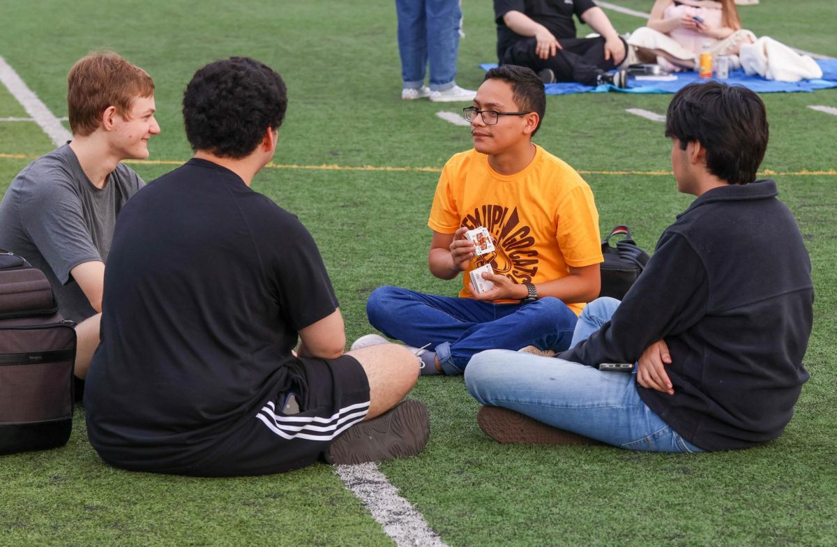 Students meet for senior sunrise, playing games and signing yearbook.