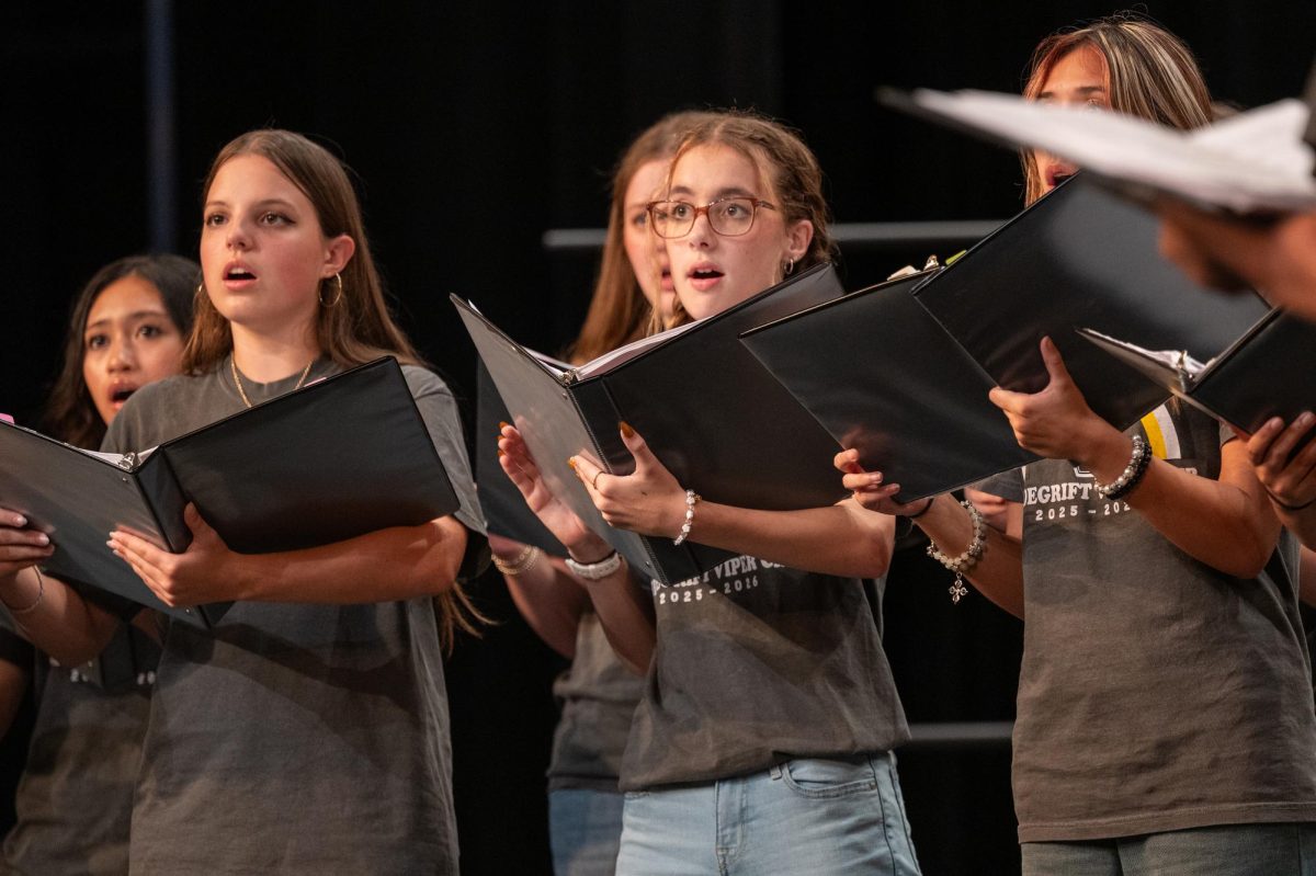 Choir performs choral showcase. Soprano 2 chamber sings Nature Boy.