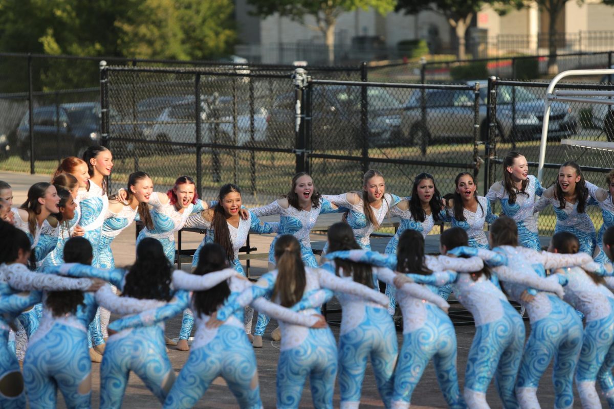 Vision runs through chants and traditions before halftime performance. The VDC consists of more than 50 dancers and two managers.