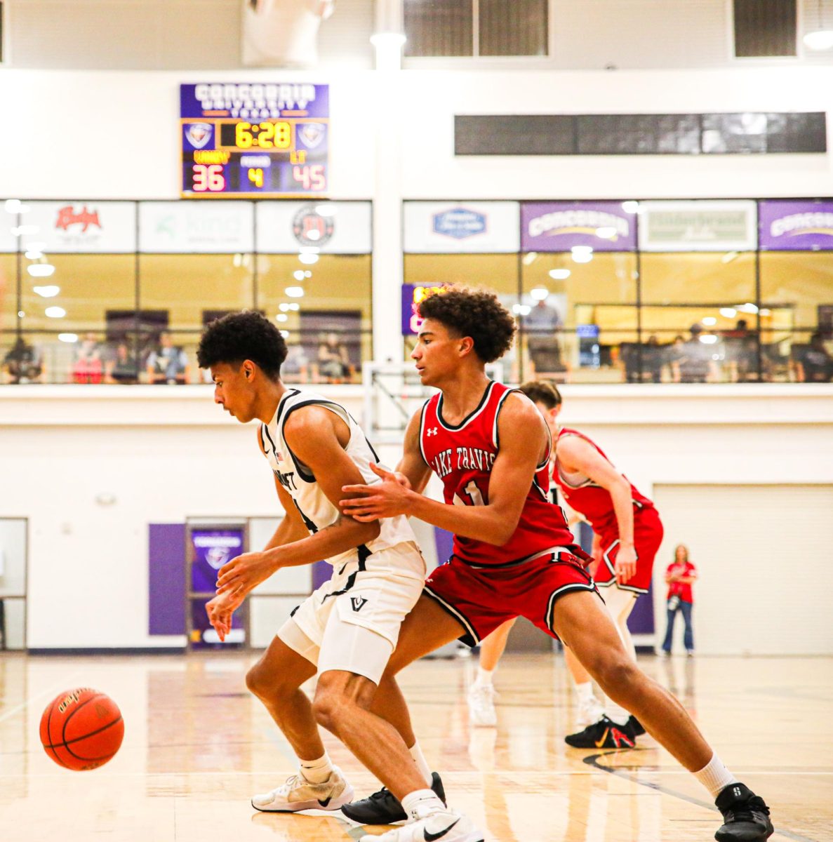 Senior Trey Block fends off defender. 