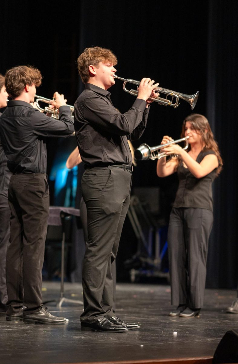 Sophomore Joshua Ray plays facing the audience while the other members face each other during their performance in the band chamber concert on March 12 in the auditorium. "Getting to play for the rest of the band, my friends and the family members was a really great experience," Ray said.