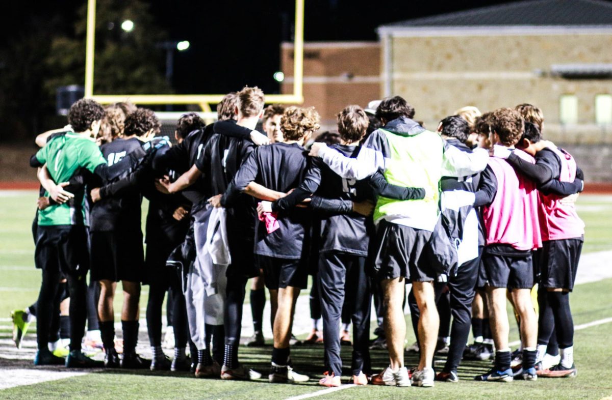 The boys soccer team huddles up to make sure they are clear on the gameplan before taking on Stony Point at Monroe Stadium on January 13. The Vipers won the game 4-1.