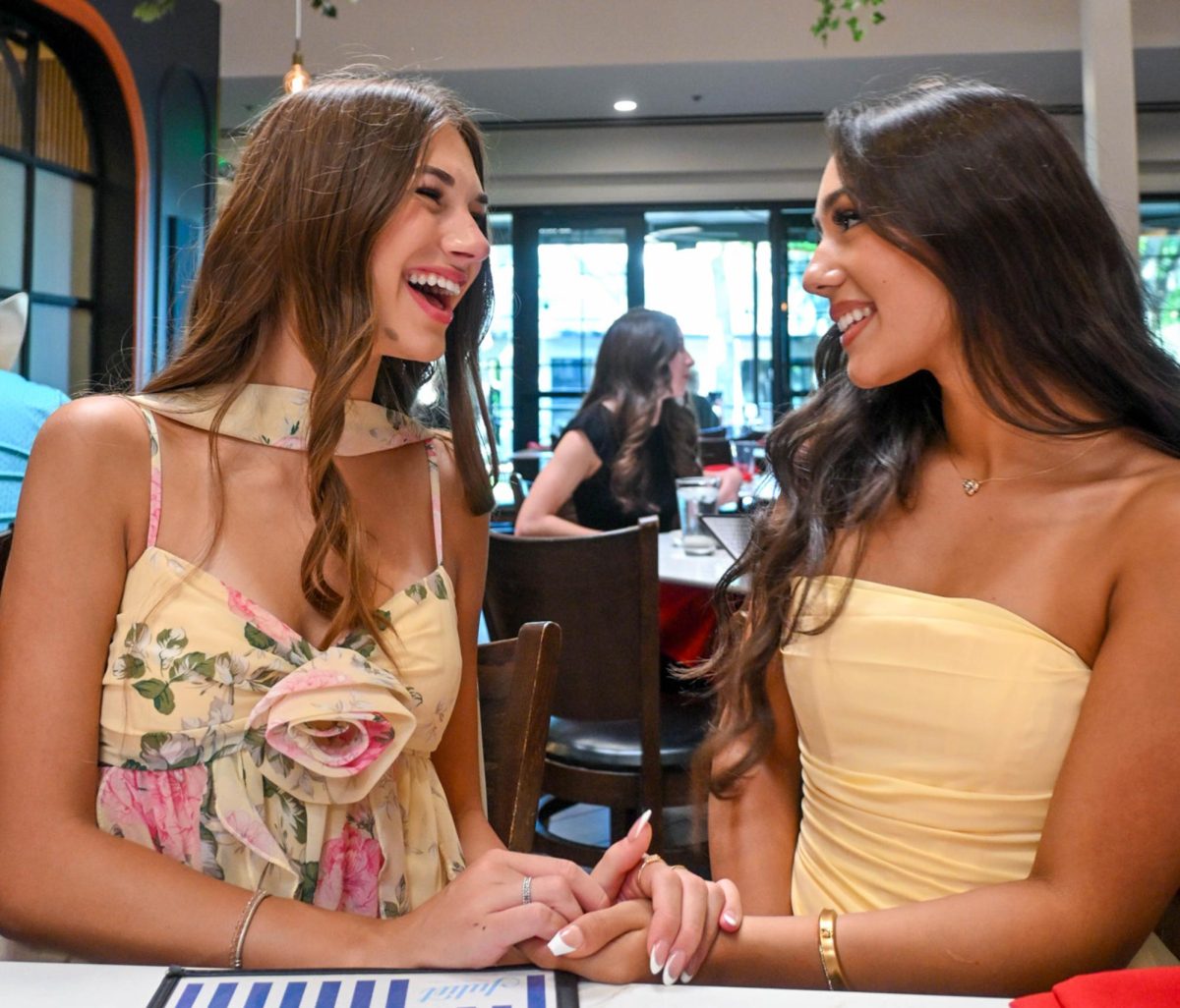 Eating dinner at Juliet before prom, juniors Sofia Jankovic and Daniella Duarte brighten in yellow.