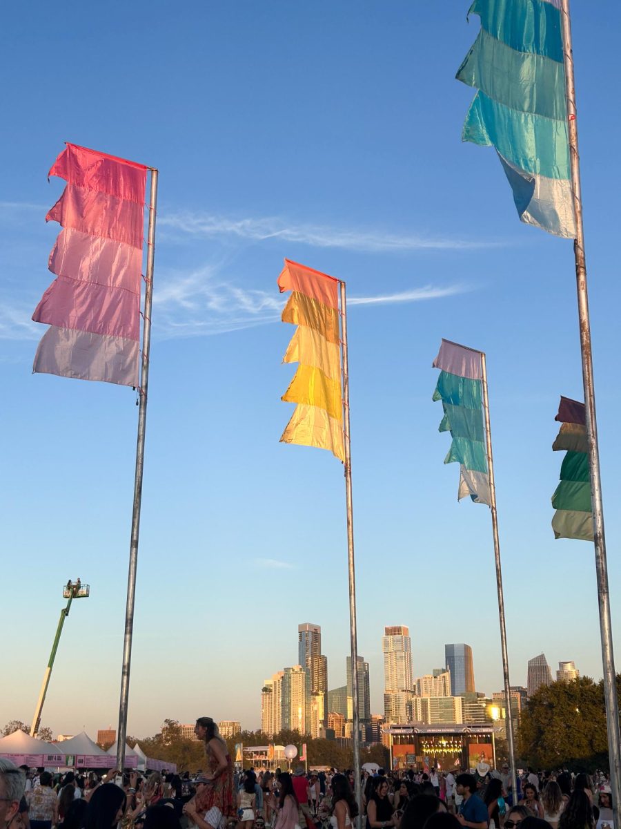Flags wave at the Austin City Limits Festival 2025. The crowd below waited for the next artist to perform.